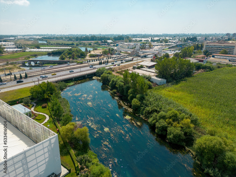 Aerial view of riverside highway on a sunny day