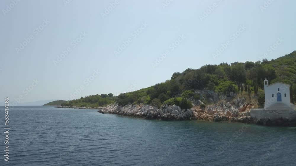 Sailing past a Greek Orthodox chapel on the coast of Ithaca, in Greece. Sailing past a Greek Orthodox chapel on the coast of Ithaca, in Greece.