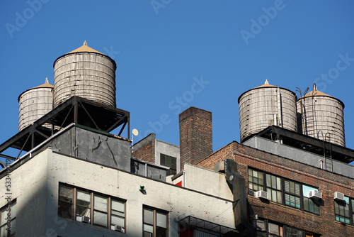 Canvas Print water tanks on buildings roof new york manhattan skyscrapers