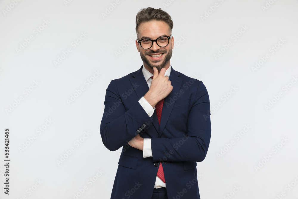 smiling elegant man touching chin and thinking, being happy smiling elegant man touching chin and thinking, being happy