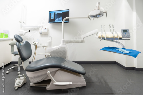 Modern dental practice. Dental chair, medical light, dental clinic without people © unai