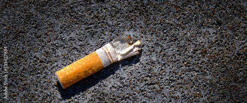 Old Cigarette Butt on Concrete Textured Dirty