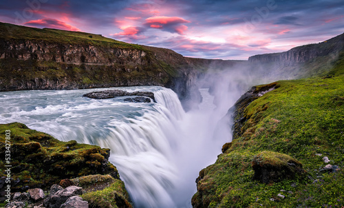 Amazing Nature landscape of Iceland. Impressively beautiful Gullfoss waterfall in canyon with colorful sky during sunset. Tipical Iceland scenery. Iconic location for photographers and bloggers