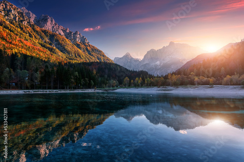 Incredible nature landscape. Amazing Lake Jasna with of a mirror reflection. Stunning vivid nature scenery of Slovenia. Wild nature image. Concept ideal resting place. Scenic image in Autumn time