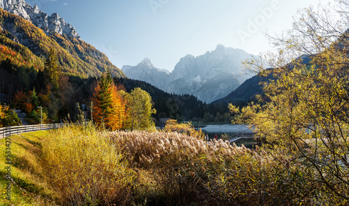 Great nature scenery in Slovenian Alps. Incredible autumn landscape on Jasna lake. Triglav national park. Kranjska Gora, Slovenia. Amazing landscape with mountain lake at sunset
