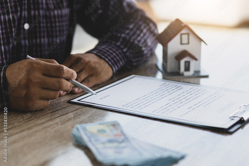 Fototapeta premium Real estate loan and mortgage contract agreement signing concept.
