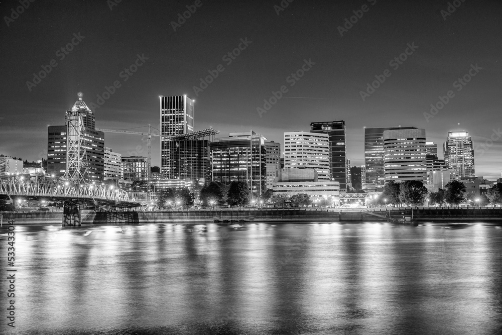 Fototapeta premium Modern night skyline of Portland with river light reflections