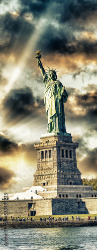 New York City, The Statue of Liberty at sunset with a beautiful colorful sky