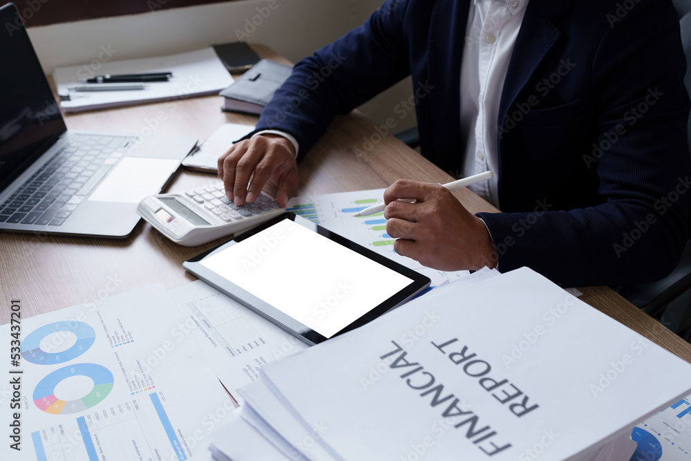 Businessman hand holding pen and pointing at financial paperwork with social network diagram Businessman hand holding pen and pointing at financial paperwork with social network diagram