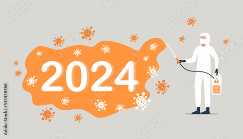 COVID-19 coronavirus a worker in a protective suit sprays a disinfectant chemical to disinfect the viral pathogen.