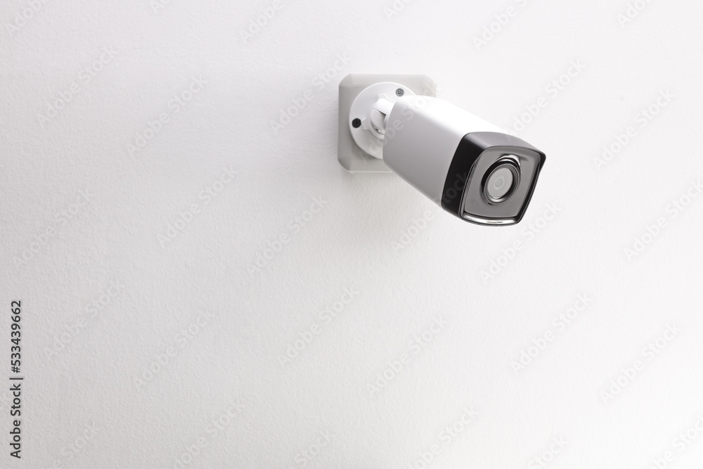 Security camera mounted on a wall Security camera mounted on a wall
