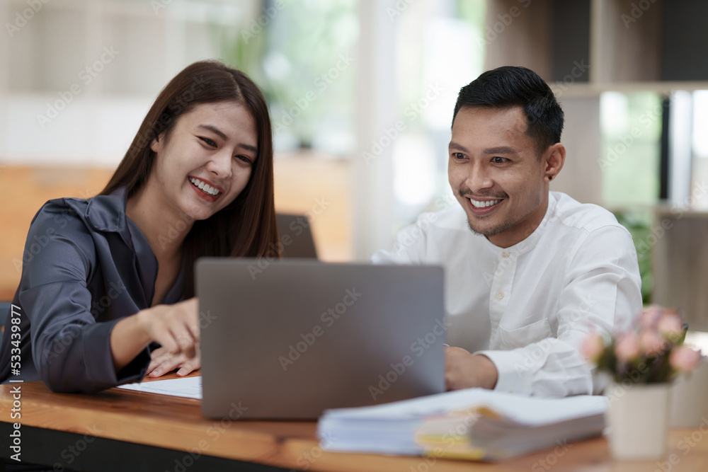 Two asian fund manager brainstorming new business project finance investment concept Two asian fund manager brainstorming new business project finance investment concept