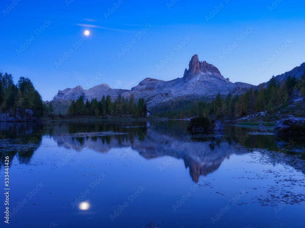 High mountains and reflection on the surface of the lake. Lago Federa, Dolomite Alps, Italy. Landscape at the night. Photo in high resolution.