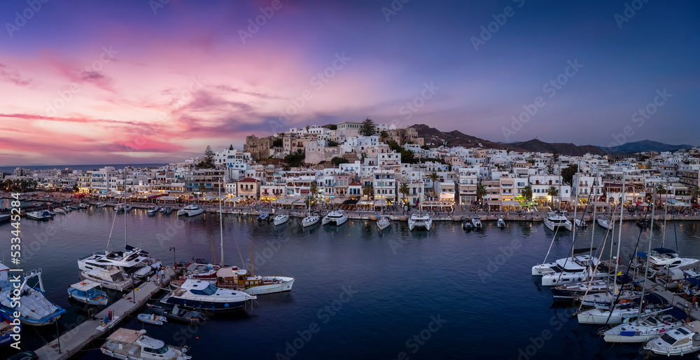 Panorama of the city and marina of Naxos island, Cyclades, Greece, during a beautiful summer evening with soft light