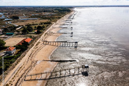 Landscape from a drone on a fishing hut by the Atlantic Ocean in France. Cabane de peche in France.