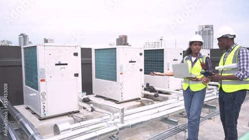 Factory engineer or maintenance technician inspects the chiller, Air conditioner, Air chillers, HVAC of large industrial plants.
