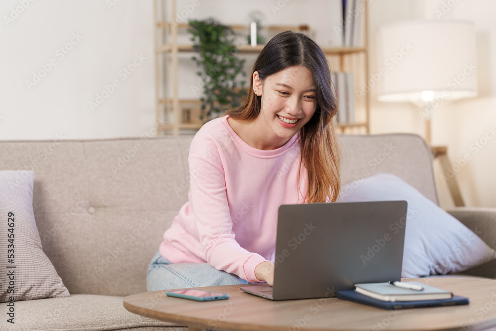Happy young attractive smiling asian woman enjoying relax time at apartment. Happy young attractive smiling asian woman enjoying relax time at apartment.