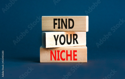 Find your niche symbol. Concept words Find your niche on wooden blocks. Beautiful grey table grey background. Business and find your niche concept. Copy space. © Dzmitry