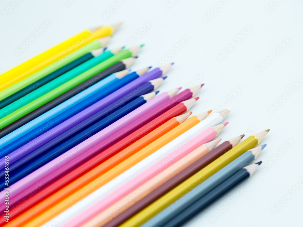 Colored pencil crayons in a row Colored pencil crayons in a row