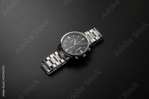 Luxury white chrome watch on black background