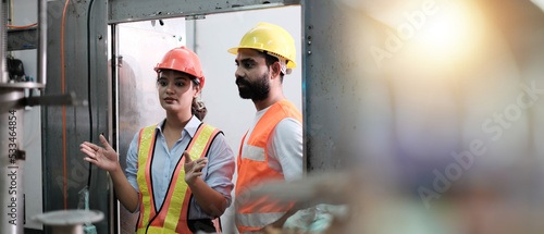 Cuadro en lienzo engineer worker working together with safety uniform and white helmet to work in industry factory handle tablet