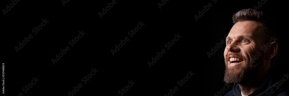 a man who marvels into the distance on a black background a man who marvels into the distance on a black background