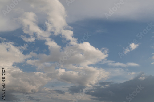Fototapeta Naklejka Na Ścianę i Meble -  White curly clouds in the blue sky