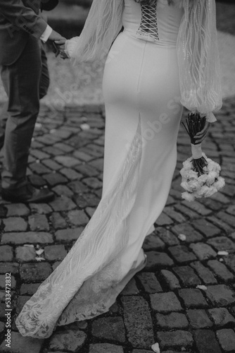 bride and groom walking on the street