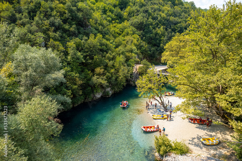 aerial view of a rafting boat and athletes in river Voidomatis with the famous clear waters in epirus Greece. photo