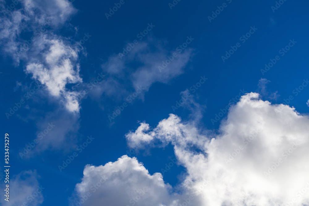Background of blue sky with white clouds. Cloudy sky during the day Background of blue sky with white clouds. Cloudy sky during the day