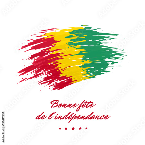 October 2, independence day guinea, vector template. Guinea flag painted with brush strokes on a light background. National holiday of october 2nd. Greeting card. Translation: Happy Independence Day