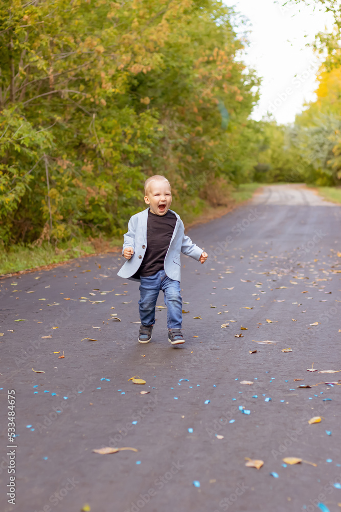 Fototapeta premium little boy running in the park