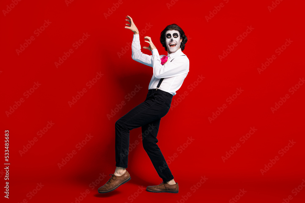 Full length body size view of his he handsome funky comic cheerful cheery scary creepy gentleman having fun zombie apocalyptic scratching isolated bright vivid shine vibrant red color background Full length body size view of his he handsome funky comic cheerful cheery scary creepy gentleman having fun zombie apocalyptic scratching isolated bright vivid shine vibrant red color background