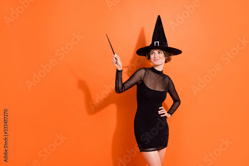 Tablou pe pânză Photo of lovely young lady wave magic stick wear stylish halloween witch black h