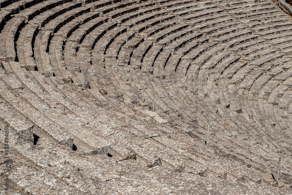 Stone seats of an ancient Greek theater in sunny day Stone seats of an ancient Greek theater in sunny day