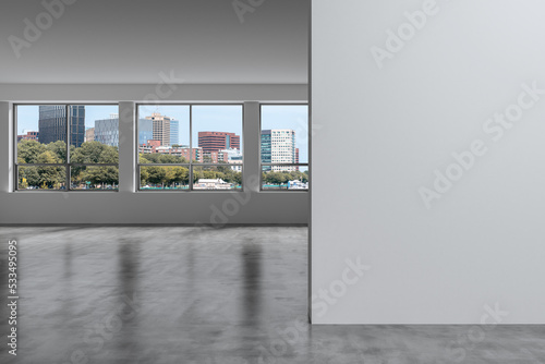 Panoramic picturesque city view of Boston at day time from modern empty room, Massachusetts. An intellectual and political center. Mockup copy space empty wall. Display concept. 3d rendering.