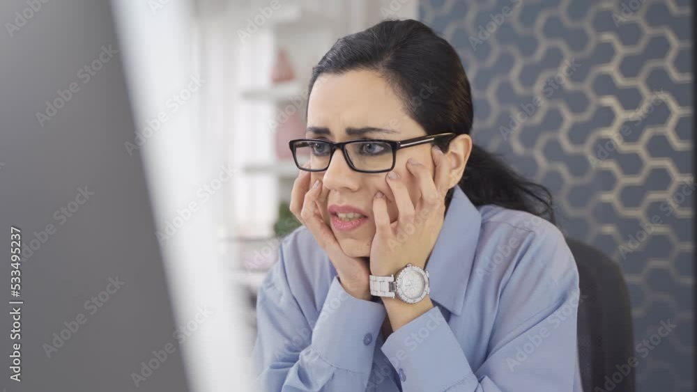 Worried business woman.
Young business woman working on computer in office is worried.
Worried business woman.
Young business woman working on computer in office is worried.