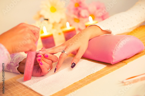 Manicure process in beauty salon, making of artificial nails