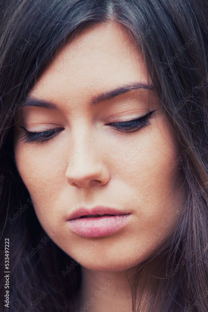 Portrait of beautiful young woman with long brown hair Portrait of beautiful young woman with long brown hair