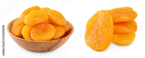 Dried apricots in wooden bowl isolated on white background with full depth of field.