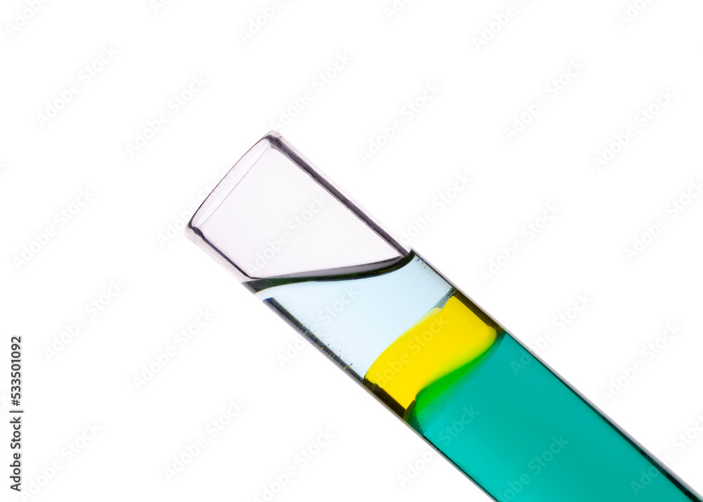 Sesame oil between colored water (below) and alcohol (above) in test tube Sesame oil between colored water (below) and alcohol (above) in test tube