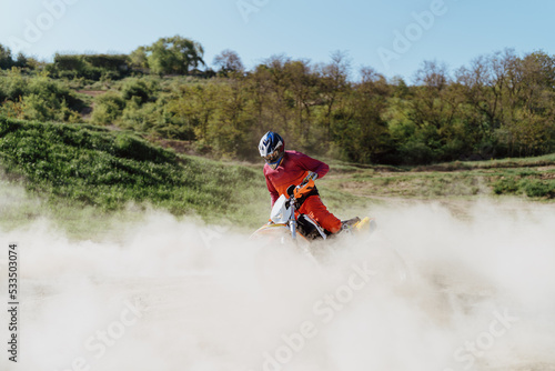 Extreme and Adrenaline. Motocross rider in action. Motocross sport. Active lifestyle. Flying dust.
