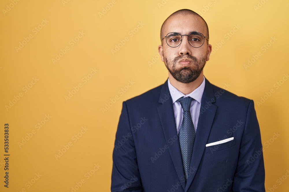 Hispanic man with beard wearing suit and tie puffing cheeks with funny face. mouth inflated with air, crazy expression. - obrazy, fototapety, plakaty 