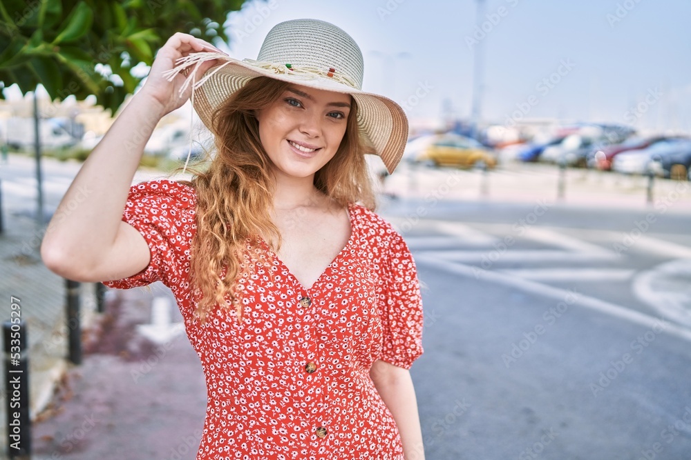 Young caucasian girl smiling confident wearing summer hat at street