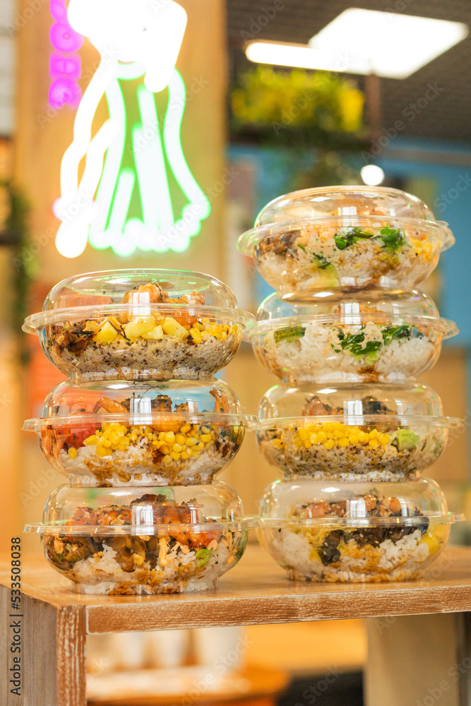 Transparent plastic containers with takeaway salad