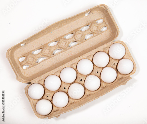 cartoon of dozen white eggs photo