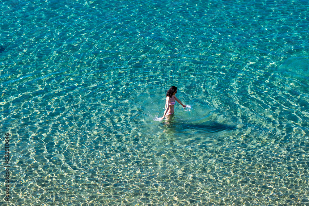 woman walking im the sea 