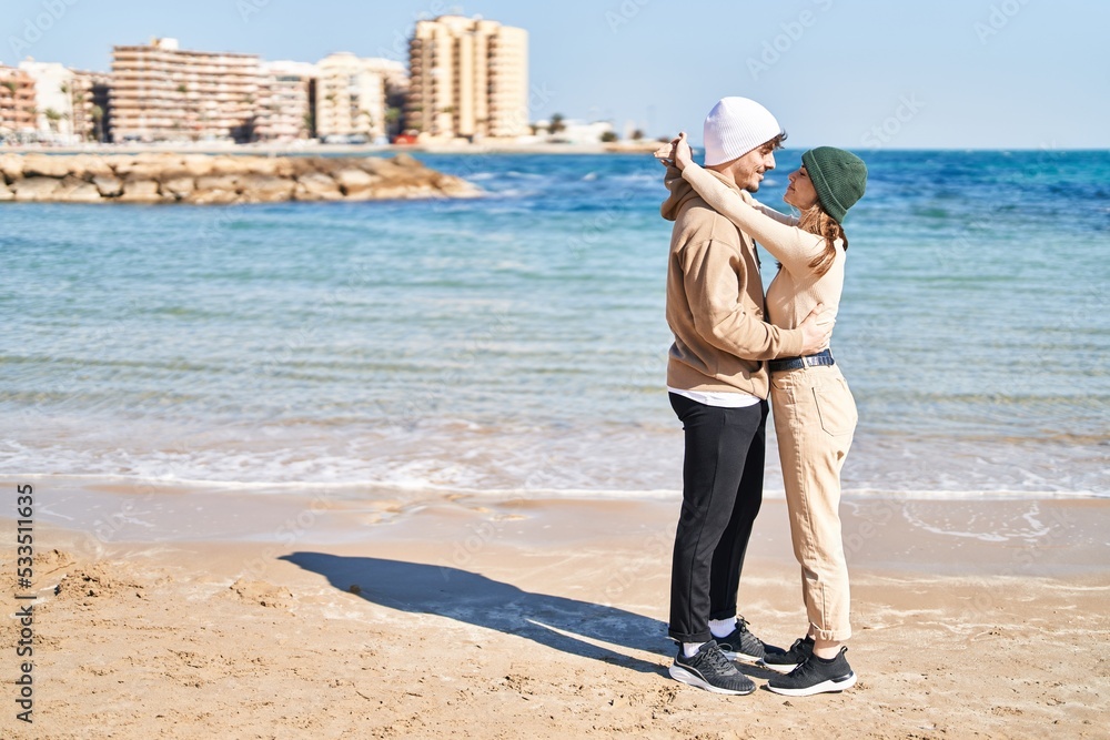 Mand and woman couple smiling confident hugging each other at seaside Mand and woman couple smiling confident hugging each other at seaside