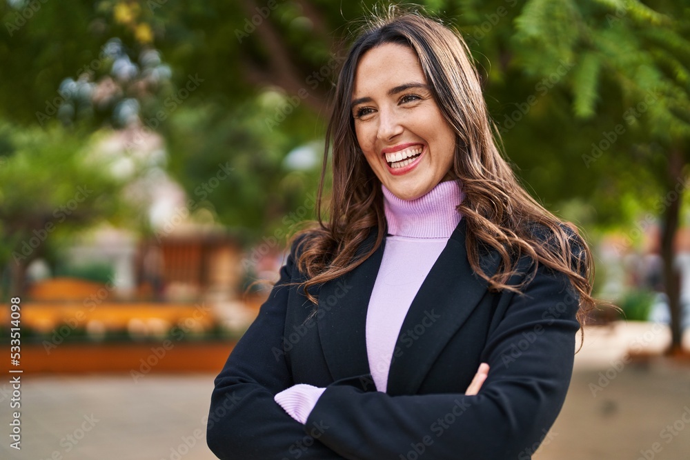 Young hispanic woman smiling confident standing with arms crossed gesture at park Young hispanic woman smiling confident standing with arms crossed gesture at park