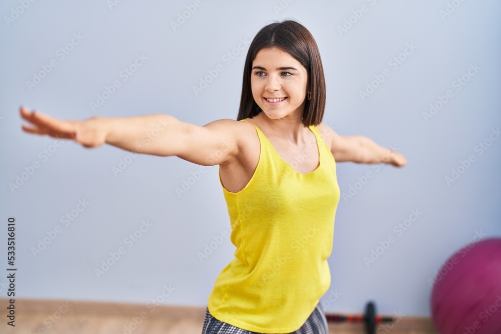 Young beautiful hispanic woman smiling confident training yoga at sport center Young beautiful hispanic woman smiling confident training yoga at sport center
